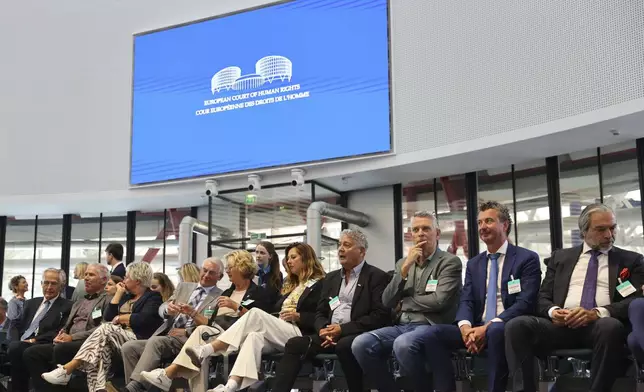 Plaintiffs sit in the European Court of Human Rights before it issues a landmark set of rulings about alleged Russian violations in Ukraine since 2014, including the downing of Malaysia Airlines flight MH17, Wednesday, July 9, 2025 in Strasbourg, eastern France. (AP Photo/Antonin Utz)