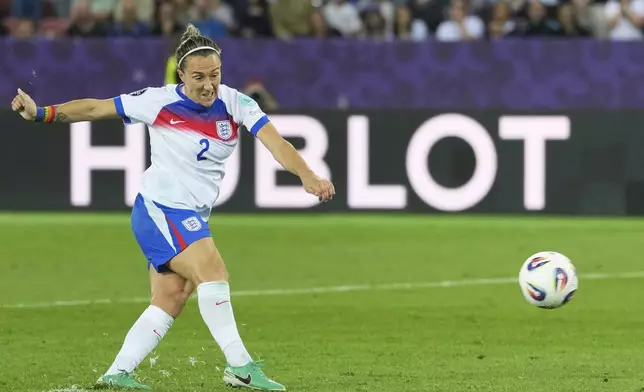 England's Lucy Bronze scores a penalty during a shootout of the Women's Euro 2025 quarterfinals soccer match between Sweden and England at Stadion Letzigrund in Zurich, Switzerland, Thursday, July 17, 2025. (AP Photo/Martin Meissner)