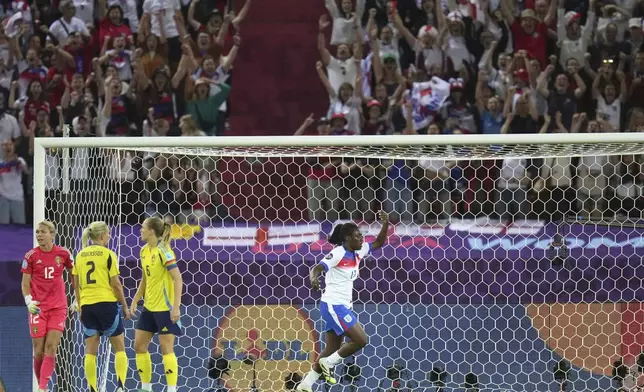 England's Michelle Agyemang celebrates after scoring her side's second goal during the Women's Euro 2025 quarterfinals soccer match between Sweden and England at Stadion Letzigrund in Zurich, Switzerland, Thursday, July 17, 2025. (AP Photo/Alessandra Tarantino)