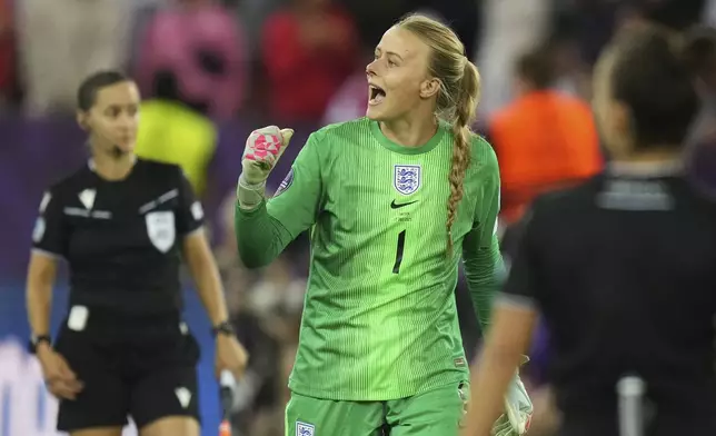 England goalkeeper Hannah Hampton celebrates during a penalty shootout at the end of the Women's Euro 2025 quarterfinals soccer match between Sweden and England at Stadion Letzigrund in Zurich, Switzerland, Thursday, July 17, 2025. (AP Photo/Alessandra Tarantino)