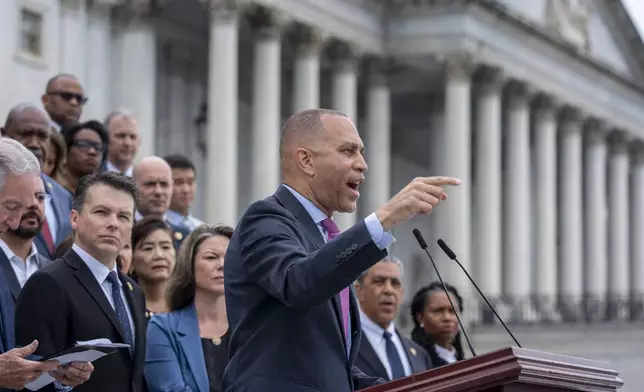 House Minority Leader Hakeem Jeffries, D-N.Y., and the Democratic Caucus assemble on the steps of the Capitol to condemn President Donald Trump's signature bill of tax breaks and spending cuts, in Washington, Wednesday, July 2, 2025. (AP Photo/J. Scott Applewhite)
