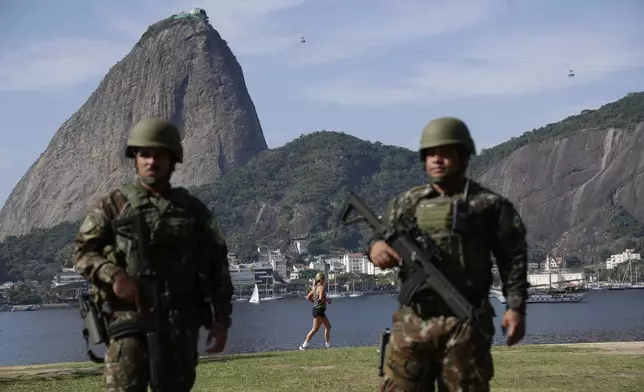 Soldiers patrol Flamengo Beach next to the Sugar Loaf mountain ahead of the 17th annual BRICS summit in Rio de Janeiro, Sunday, July 6, 2025. (AP Photo/Bruna Prado)