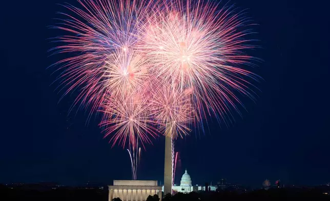 Fireworks explode over Lincoln Memorial, Washington Monument and U.S. Capitol, along the National Mall, during Fourth of July celebrations, in Washington, Friday, July 4, 2025. (AP Photo/Jose Luis Magana)