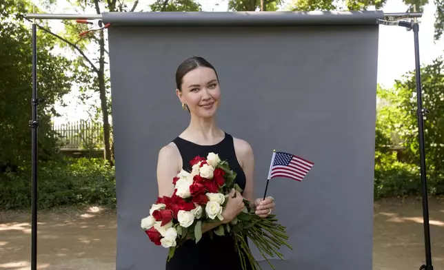 New U.S. citizen Kamilla Giliazova, from Russia, poses for a portrait following the Naturalization Ceremony on Independence Day at George Washington's Mount Vernon, Friday, July 4, 2025, in Alexandria, Va. (AP Photo/Rod Lamkey, Jr.)