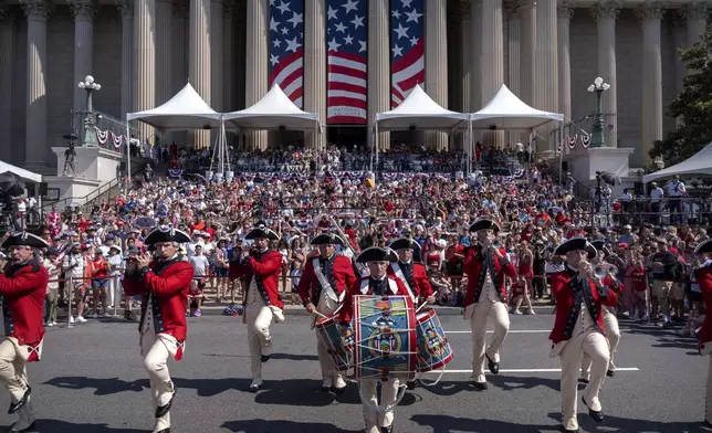 Members of the U.S. Army Old Guard Fife and Drum Corps perform during Fourth of July festivities at the National Archives, Friday, July 4, 2025, in Washington. (AP Photo/Mark Schiefelbein)