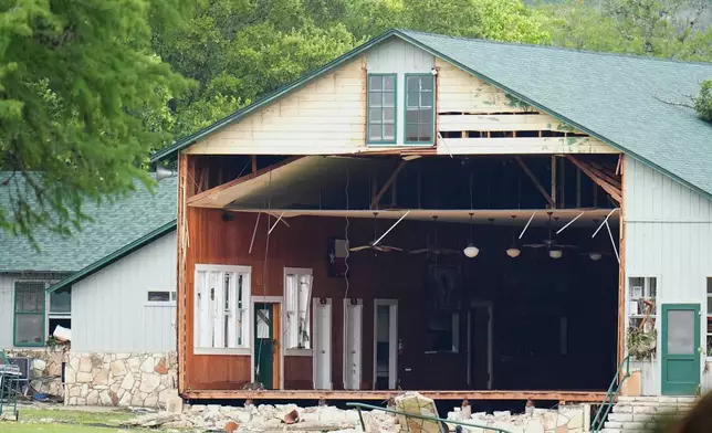 A wall is missing on a building at Camp Mystic along the banks of the Guadalupe River, Saturday, July 5, 2025, in Hunt, Texas, after a flash flood swept through the area. (AP Photo/Julio Cortez)