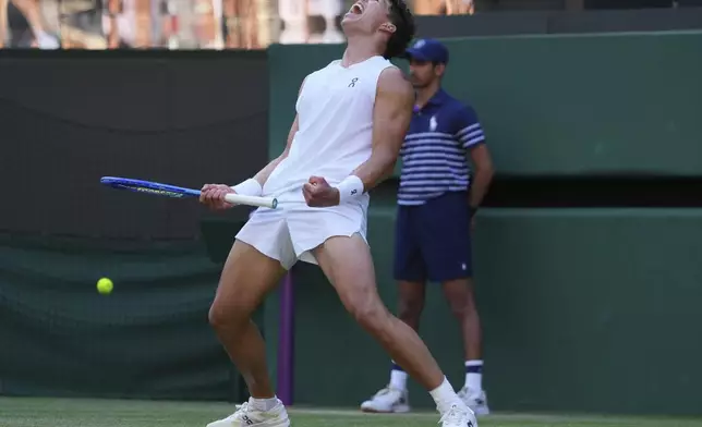 Ben Shelton of the U.S. celebrates winning the men's singles fourth round match against Lorenzo Sonego of Italy at the Wimbledon Tennis Championships in London, Monday, July 7, 2025.(AP Photo/Kirsty Wigglesworth)
