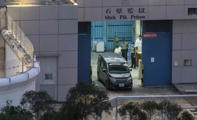 FILE -Vehicles believed to be carrying former pro-democracy lawmaker Gary Fan, who was released after four years for his conviction under the national security law, leaves the Shek Pik Prison in Hong Kong, April 29, 2025. (AP Photo/Chan Long Hei, File)