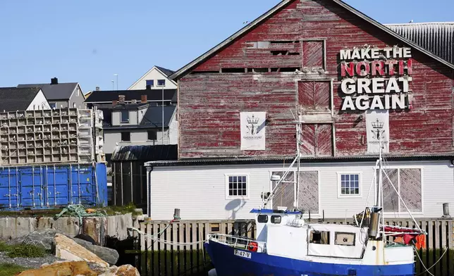 Seagulls sit in boxes of a so called Seagull Hotel at the harbour in Vardo, Norway, on July 3, 2025. (AP Photo/Tommi Ojala )
