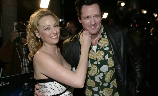 FILE - Actors Virginia Madsen, left, and her brother Michael Madsen appear at the premiere of "The Astronaut Farmer" in Los Angeles on Feb. 20, 2007. (AP Photo/Matt Sayles, File)