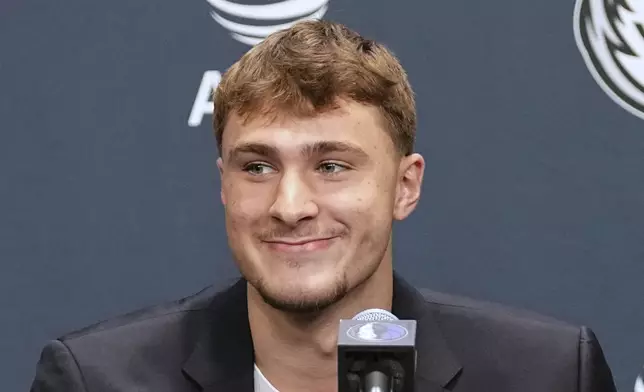 Dallas Mavericks' Cooper Flagg, the No. 1 overall pick in the NBA draft, takes questions during an NBA basketball press conference at the team's practice facility, Friday, June 27, 2025, in Dallas. (AP Photo/Tony Gutierrez)