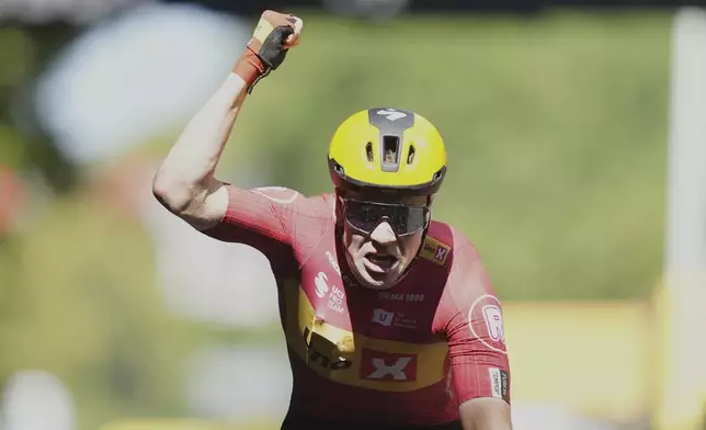Norway's Jonas Abrahamsen celebrates as he crosses the finish line to win the eleventh stage of the Tour de France cycling race over 156.8 kilometers (97.4 miles) with start and finish in Toulouse, France, Wednesday, July 16, 2025. (AP Photo/Thibault Camus)