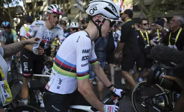 Slovenia's Tadej Pogacar leaves after the eleventh stage of the Tour de France cycling race over 156.8 kilometers (97.4 miles) with start and finish in Toulouse, France, Wednesday, July 16, 2025. (Christophe Petit Tesson, Pool via AP)
