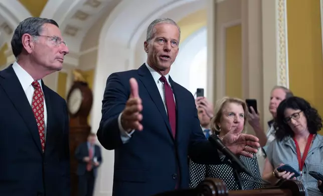 Senate Majority Leader John Thune, R-S.D., joined at left by Sen. John Barrasso, R-Wyo., the GOP whip, speaks to reporters following closed-door strategy meetings, at the Capitol in Washington, Tuesday, July 22, 2025. (AP Photo/J. Scott Applewhite)
