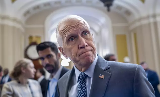 Sen. Thom Tillis, R-N.C., a member of the Senate Banking Committee, tells reporters that it would be a mistake for President Donald Trump to fire Federal Reserve Chair Jerome Powell, during a vote in the Senate, at the Capitol in Washington, Wednesday, July 16, 2025. (AP Photo/J. Scott Applewhite)
