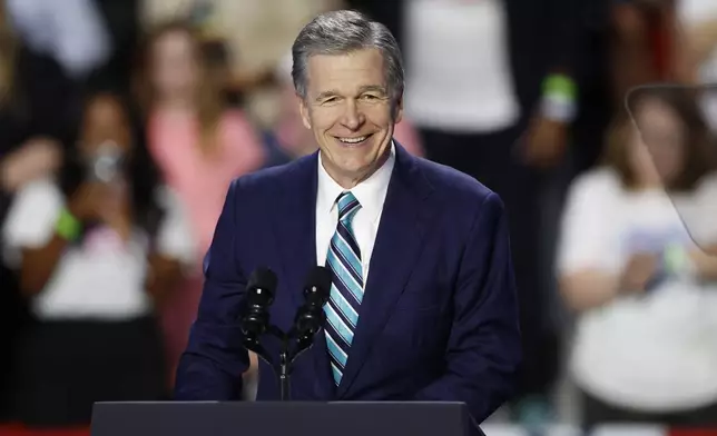 FILE - North Carolina Gov. Roy Cooper speaks at a campaign event in Charlotte, N.C., Sept. 12, 2024. (AP Photo/Nell Redmond, File)