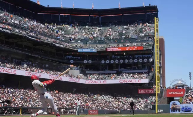 Philadelphia Phillies' Bryce Harper hits a home run against the San Francisco Giants during the fourth inning of a baseball game in San Francisco, Wednesday, July 9, 2025. (AP Photo/Jeff Chiu)