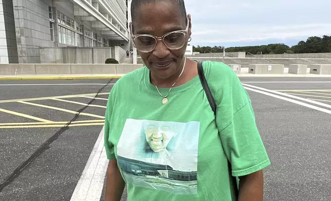 Elizabeth Alvarado stands outside federal court in Central Islip, N.Y., on Wednesday, July 2, 2025, wearing a shirt bearing an image of her daughter, Nisa Mickens, who was slain by MS-13 gang members in 2016. (AP Photo/Philip Marcelo)
