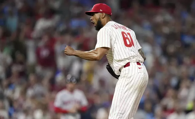 Philadelphia Phillies' Cristopher Sánchez reacts after the Phillies won a baseball game against the Boston Red Sox Tuesday, July 22, 2025, in Philadelphia. (AP Photo/Matt Slocum)