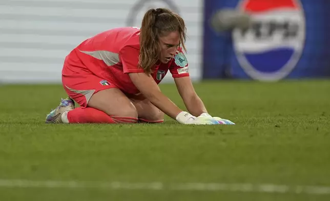 Italy's goalkeeper Laura Giuliani reacts after losing to England in the Women's Euro 2025 semifinals soccer match between England and Italy at Stade de Geneve in Geneva, Switzerland, Tuesday, July 22, 2025. (AP Photo/Martin Meissner)
