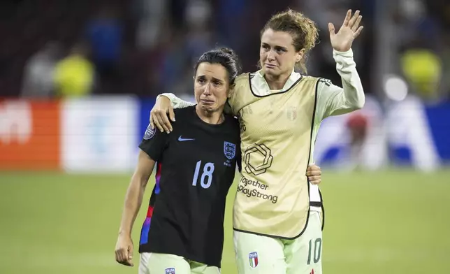 Italy's Arianna Caruso, left, and Cristiana Girelli, right, react after the Women's Euro 2025 semifinals soccer match between England and Italy at Stade de Geneve in Geneva, Switzerland, Tuesday, July 22, 2025. (Jean-Christophe Bott/Keystone via AP)