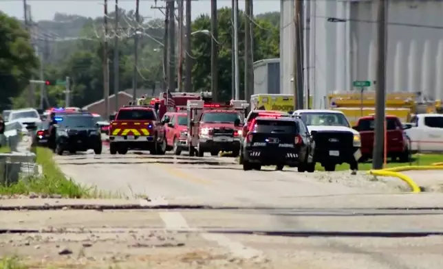 In this image taken from video provided by KETV, police and firefighters respond to the scene of an explosion in Fremont, Neb., Tuesday, July 29, 2025. (KETV via AP)
