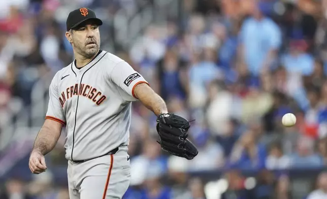 San Francisco Giants pitcher Justin Verlander (35) catches the ball thrown back by his catcher during second inning MLB baseball action against the Toronto Blue Jays in Toronto on Friday, July 18, 2025. (Nathan Denette/The Canadian Press via AP)