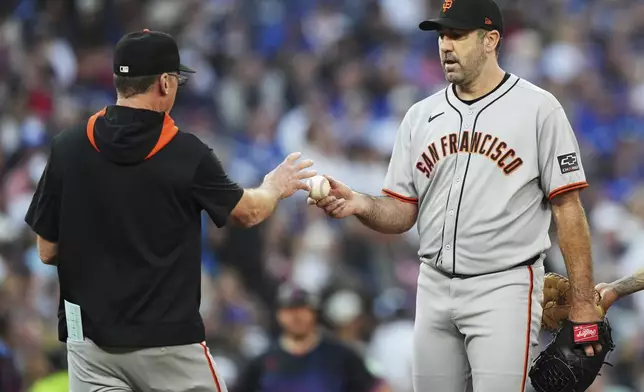 San Francisco Giants pitcher Justin Verlander (35) is taken out of the game by manager Bob Melvin against the Toronto Blue Jays during third inning MLB baseball action in Toronto on Friday, July 18, 2025. (Nathan Denette/The Canadian Press via AP)