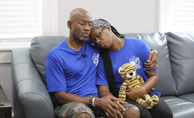 Clarence and Ebony Carr hug as they talk about the death of their son from a brain-eating amoeba he got at a popular South Carolina lake on Tuesday, July 29, 2025, in Columbia, S.C.. (AP Photo/Jeffrey Collins)