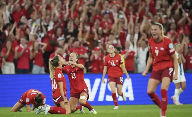 Switzerland players react at the end of the Euro 2025, group A, soccer match between Finland and Switzerland at Stade de Geneve in Geneva, Switzerland, Thursday, July 10, 2025. (AP Photo/Alessandra Tarantino)