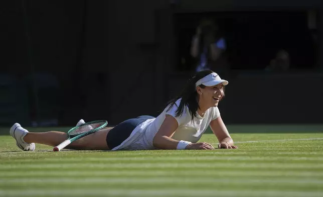 Amanda Anisimova of the U.S. celebrates winning the women's singles quarter finals match against Anastasia Pavlyuchenkova of Russia at the Wimbledon Tennis Championships in London, Tuesday, July 8, 2025.(AP Photo/Kin Cheung)