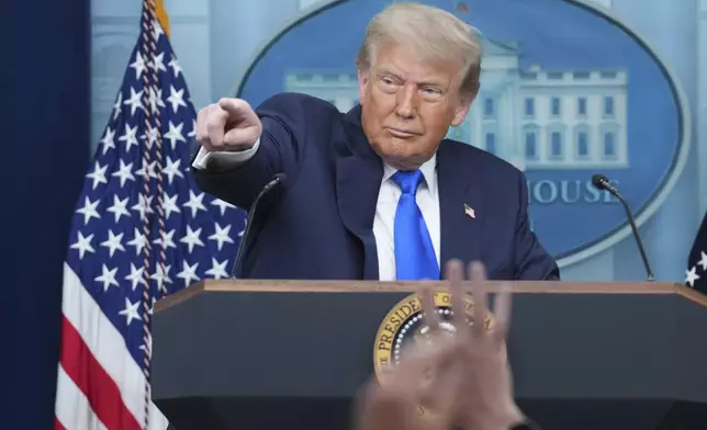 President Donald Trump points to a reporter to take a question as he speaks to the media, Friday, June 27, 2025, in the briefing room of the White House in Washington. (AP Photo/Jacquelyn Martin)