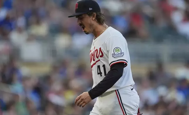 Minnesota Twins starting pitcher Joe Ryan yells while walking back to the dugout after completing the bottom of the fifth inning of a baseball game against the Washington Nationals, Saturday, July 26, 2025, in Minneapolis. (AP Photo/Abbie Parr)