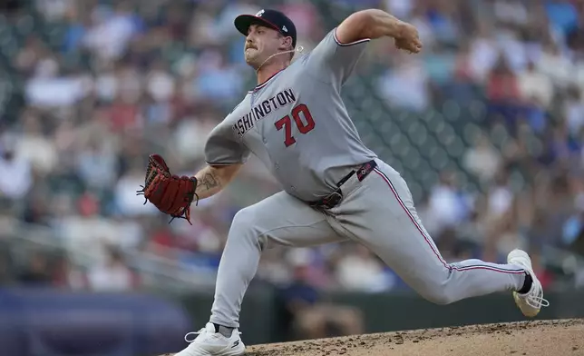 Washington Nationals starting pitcher Mitchell Parker delivers during the third inning of a baseball game against the Minnesota Twins, Saturday, July 26, 2025, in Minneapolis. (AP Photo/Abbie Parr)