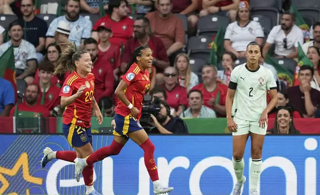 Spain's Vicky Lopez, center, scores celebrates after scoring her side's second goal during the Euro 2025, group B, soccer match between Spain and Portugal at Stadion Wankdorf in Bern, Switzerland, Thursday, July 3, 2025. (AP Photo/Martin Meissner)