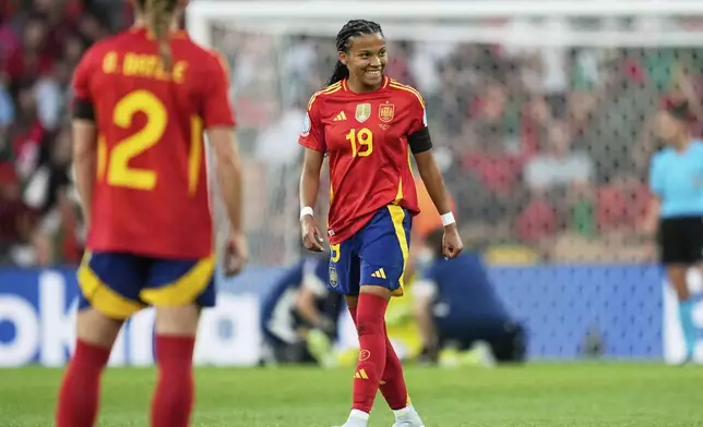 Spain's Vicky Lopez, center, celebrates after scoring her side's second goal during the Euro 2025, group B, soccer match between Spain and Portugal at Stadion Wankdorf in Bern, Switzerland, Thursday, July 3, 2025. (AP Photo/Martin Meissner)