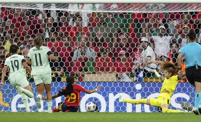 Spain's Vicky Lopez, center, scores her side's second goal during the Euro 2025, group B, soccer match between Spain and Portugal at Stadion Wankdorf in Bern, Switzerland, Thursday, July 3, 2025. (AP Photo/Martin Meissner)