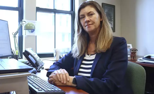 Massachusetts Health Connector Executive Director Audrey Morse Gasteier poses for a portrait at her desk in the state health insurance marketplace's office Tuesday, July 2, 2025, in Boston. (AP Photo /Leah Willingham)