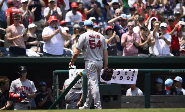 Boston Red Sox starting pitcher Lucas Giolito (54) walks back to the dugout after he was pulled form the game during the eighth inning of a baseball game against the Washington Nationals, Friday, July 4, 2025, in Washington. (AP Photo/Nick Wass)