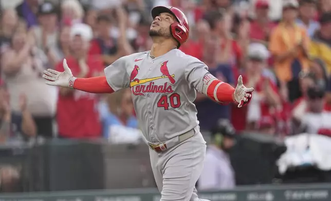 St. Louis Cardinals' Willson Contreras gestures as he circles the bases after hitting a solo home run off Colorado Rockies starting pitcher Austin Gomber in the fourth inning of a baseball game Monday, July 21, 2025, in Denver. (AP Photo/David Zalubowski)