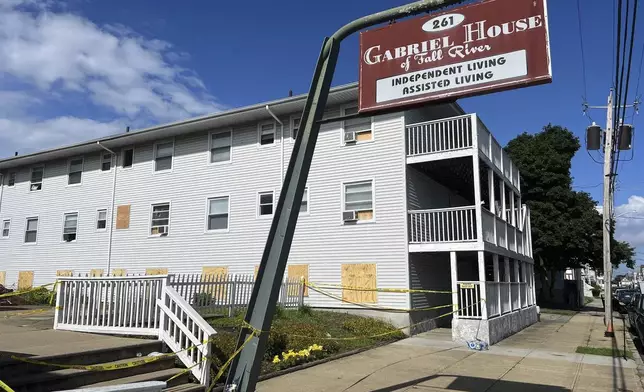 Boards cover the windows of the Gabriel House assisted living facility, where a fire on Sunday killed several people, Tuesday, July 15, 2025 in Fall River, Mass. (AP Photo/Kimberlee Kruesi)