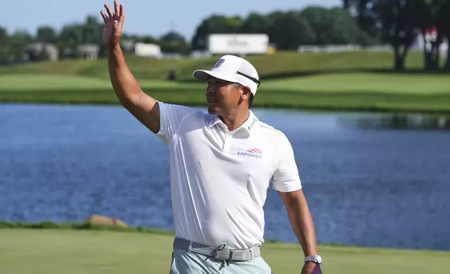 Kurt Kitayama arrives for a trophy ceremony after winning the 3M Open golf tournament at the Tournament Players Club Sunday, July 27, 2025, in Blaine, Minn. (AP Photo/Abbie Parr)