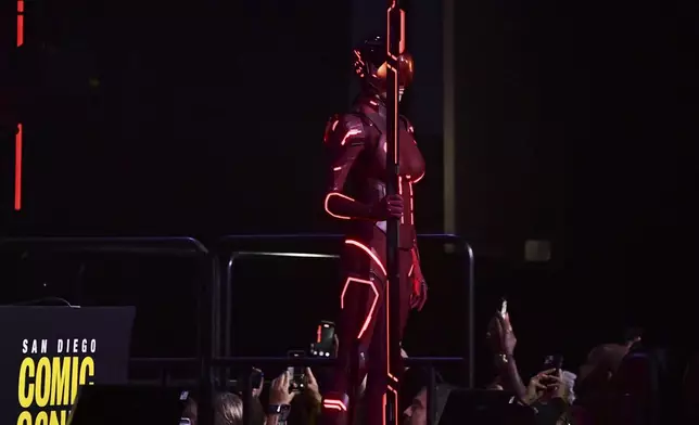 A person dressed in costume attends a panel for "Tron: Ares" during Comic-Con International on Friday, July 25, 2025, in San Diego. (Photo by Richard Shotwell/Invision/AP)