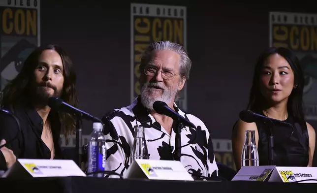 Jared Leto, from left, Jeff Bridges, and Greta Lee attend a panel for "Tron: Ares" during Comic-Con International on Friday, July 25, 2025, in San Diego. (Photo by Richard Shotwell/Invision/AP)