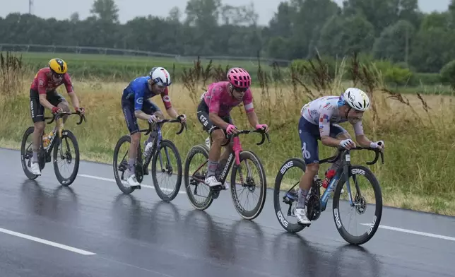 France's Mathieu Burgaudeau, right, leads Italy's Vincenzo Albanese, France's Quentin Pacher and Norway's Jonas Abrahamsenduring the seventeenth stage of the Tour de France cycling race over 160.4 kilometers (99.7 miles) with start in Bollene and finish in Valence, France, Wednesday, July 23, 2025. (AP Photo/Mosa'ab Elshamy)