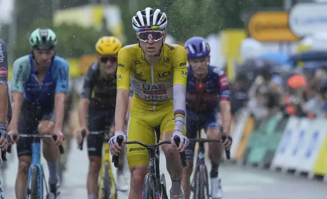 Slovenia's Tadej Pogacar crosses the finish line to complete the seventeenth stage of the Tour de France cycling race over 160.4 kilometers (99.7 miles) with start in Bollene and finish in Valence, France, Wednesday, July 23, 2025. (AP Photo/Mosa'ab Elshamy)