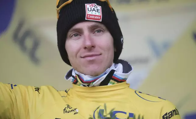 Slovenia's Tadej Pogacar wears the yellow jersey of the race overall leader after completing the seventeenth stage of the Tour de France cycling race over 160.4 kilometers (99.7 miles) with start in Bollene and finish in Valence, France, Wednesday, July 23, 2025. (AP Photo/Thibault Camus)