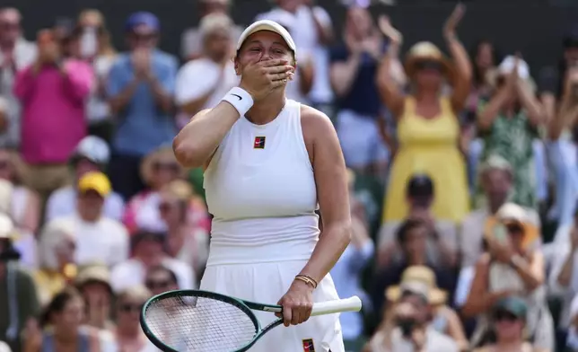 Amanda Anisimova of the U.S. celebrates winning the women's singles semifinal match against Aryna Sabalenka of Belarus at the Wimbledon Tennis Championships in London, Thursday, July 10, 2025.(AP Photo/Kirsty Wigglesworth)
