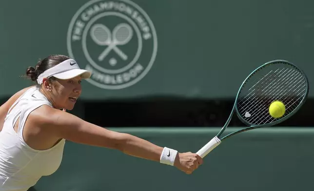 Amanda Anisimova of the U.S. returns to Aryna Sabalenka of Belarus during a women's singles semifinal match at the Wimbledon Tennis Championships in London, Thursday, July 10, 2025. (AP Photo/Kin Cheung)
