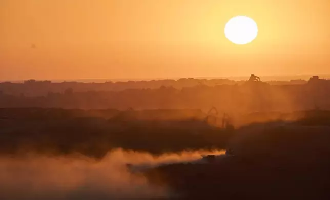 An Israeli army vehicle moves in the Gaza Strip as seen from southern Israel on Sunday, July 6, 2025. (Photo/Ohad Zwigenberg)